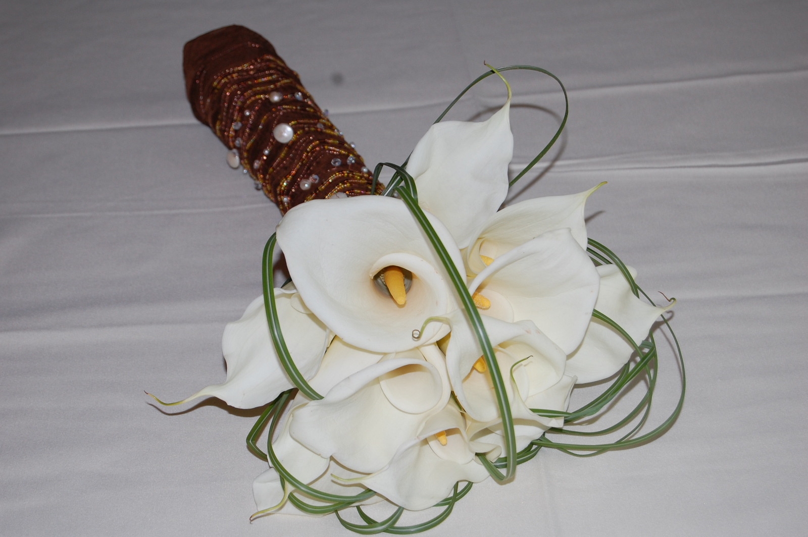 Hand tied callas with jewelled wrap