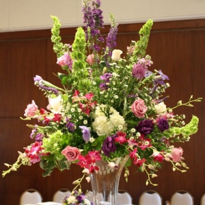 Tall glass pedestal centerpiece for wedding