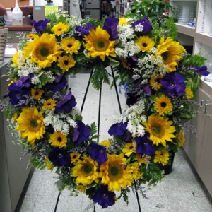 Symp. heart with sunflowers and anemones.