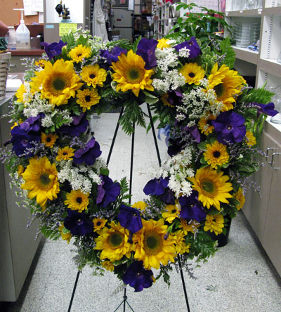 Symp. heart with sunflowers and anemones.