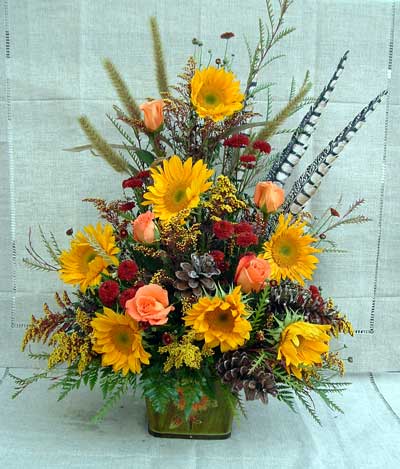 Sympathy piece with sunflowers and pheasant feathers