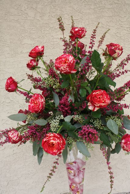 Tall glass pedestal centerpiece for wedding with Eufloria roses