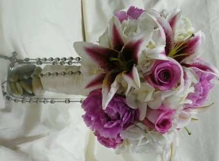 Trinity Flowers Pink Peonies, Stargazer lilies and rosary portrait bouquet